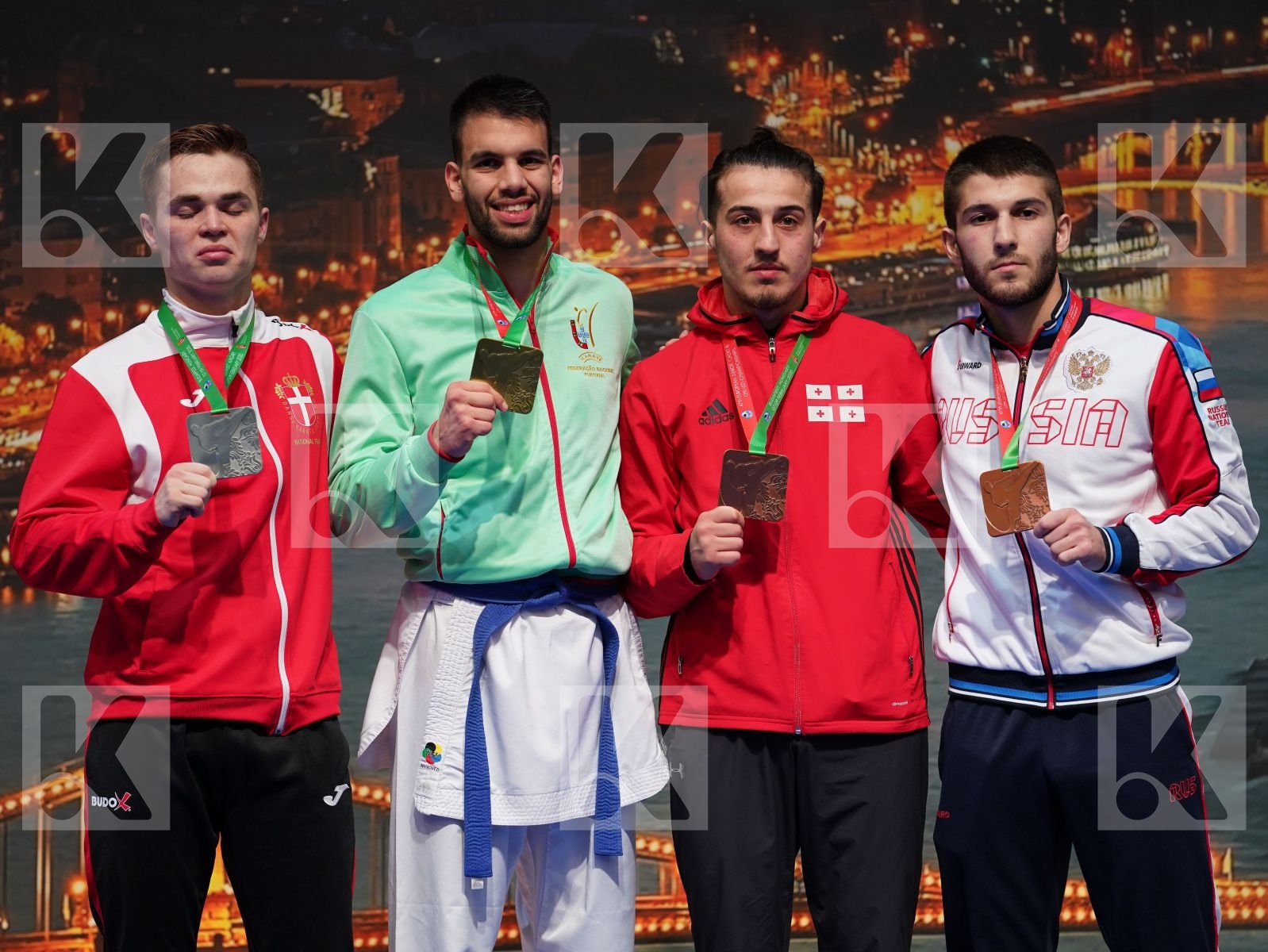 ALMEIDA TIAGO (PORTUGAL), NIELSEN CHRISTOFFER (DENMARK), GIORGADZE ZURAB (GEORGIA), MAMEDOV ASIMAN (RUSSIAN FEDERATION) in Under 21 Kumite Male -75 Kg - Podium ceremony