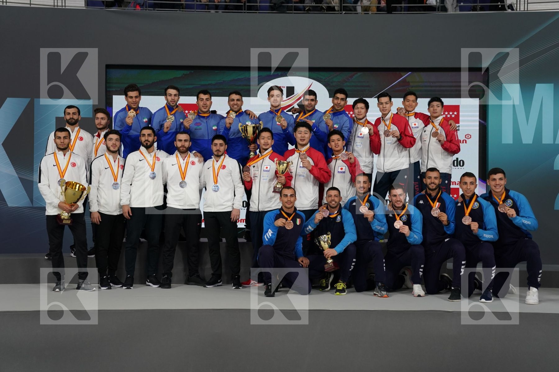 TURKEY (AKTAS, ELTEMUR, GOK, KAPTAN, OZER, UYGUR, YAMANOGLU), IRAN (ABAZARI, ASGARI GHONCHEH, ASIABARI, GANJZADEH, HEYDARI, KHODABAKHSHI, POORSHAB), JAPAN (ANDO, ARAGA, KAGAWA, MORI, NISHIMURA, SAKIYAMA, SHIMADA), ITALY (EL SHARABY, JENDOUBI, MAESTRI, MARESCA, MARINO, MARTINA, MINARDI) in Senior Team Male Kumite - Podium ceremony