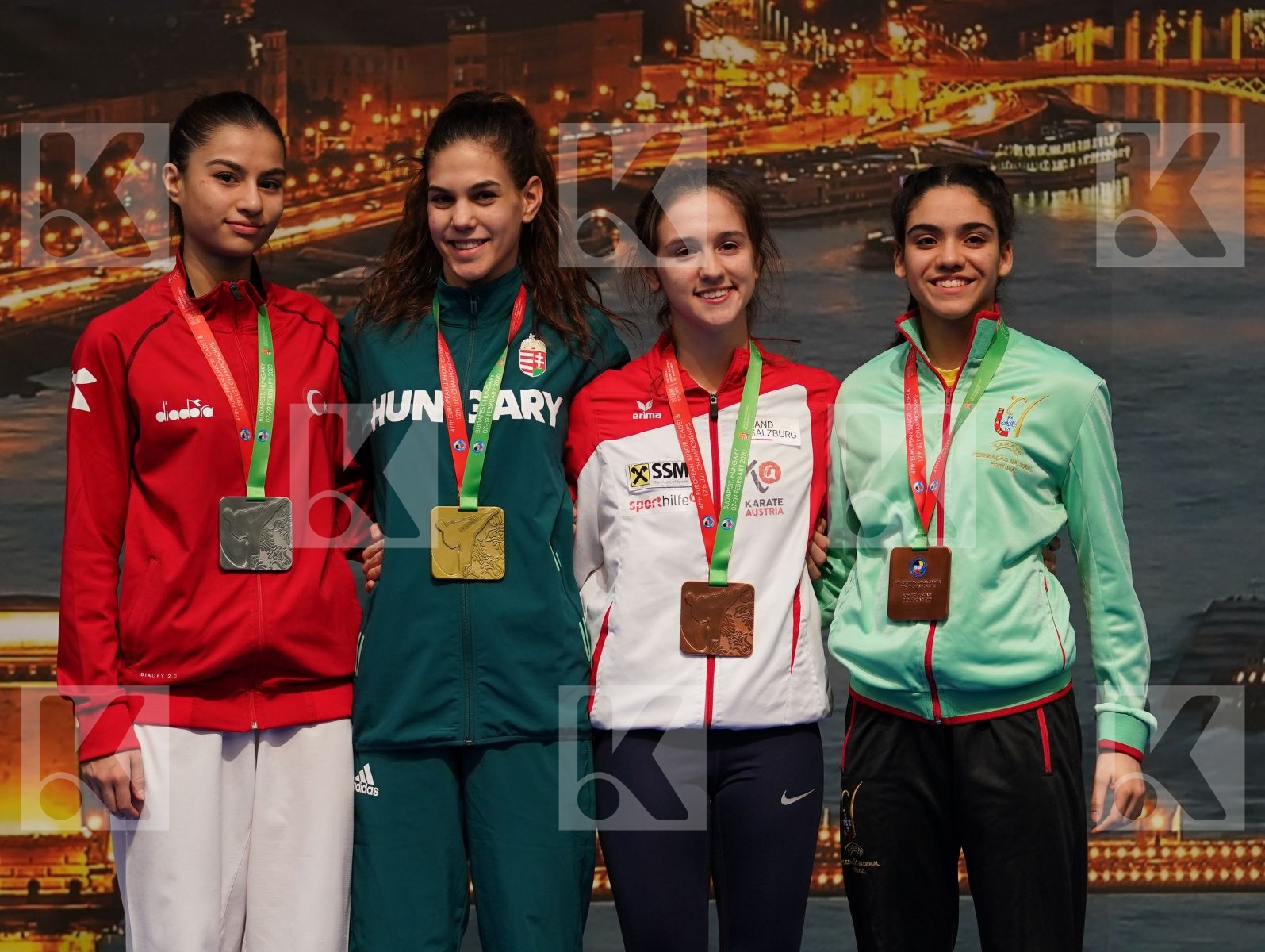 JAKUBOVICS DALMA (HUNGARY), BALIK HAZEL (TURKEY), GRUJIC ALEKSANDRA (AUSTRIA), MATOS CONSTANCA (PORTUGAL) in Junior Kumite Female -48 Kg - Podium ceremony