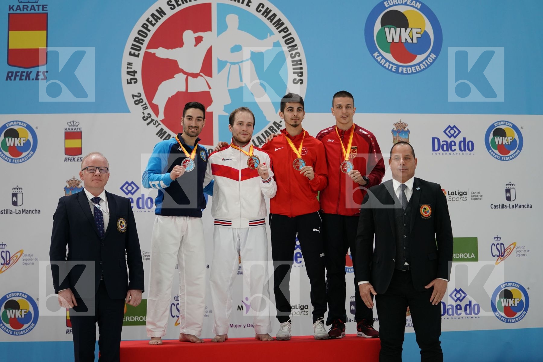 CRESCENZO ANGELO (ITALY), PLAKHUTIN EVGENY (RUSSIA), SAMDAN ERAY (TURKEY), PAVLOV EMIL (MACEDONIA) in Senior Kumite -60 Kg - Podium ceremony