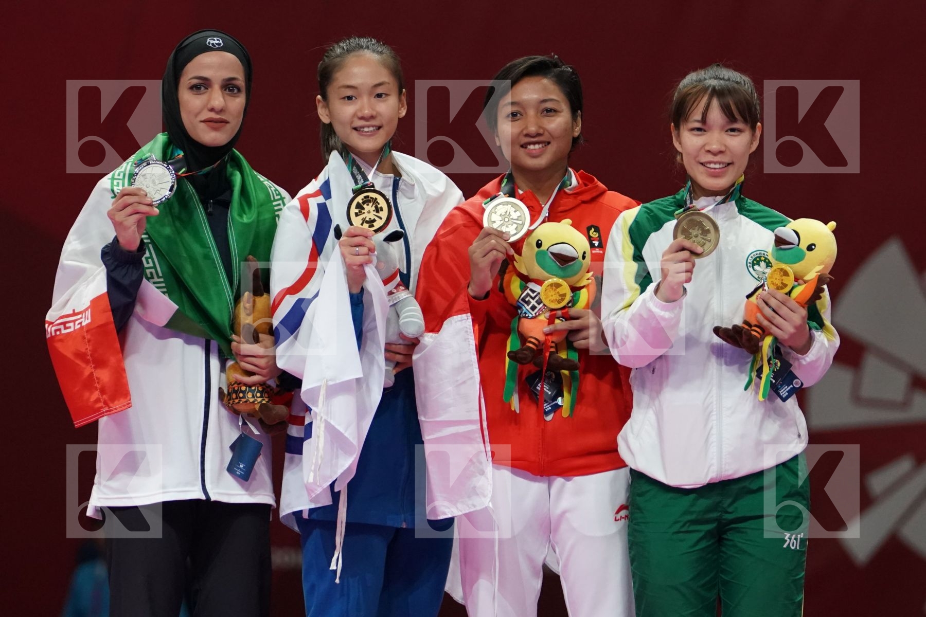 TARAVAT KHAKSAR (ISLAMIC REPUBLIC OF IRAN), TZUYUN WEN (CHINESE TAIPEI), COKORDA ISTRI AGUNG SANISTYARANI (INDONESIA), SOK I WONG (MACAO) in Senior Kumite -55 Kg - podium ceremony